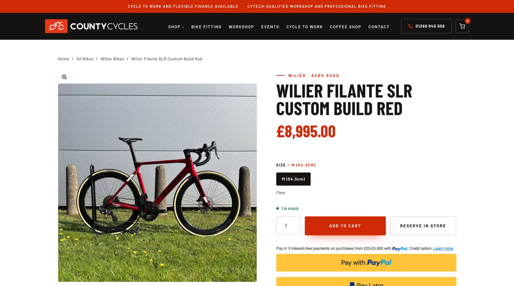A County Cycles product page for a red Wilier Filante SLR: photograph, price, size selector, stock status and Add to cart and Reserve in store buttons